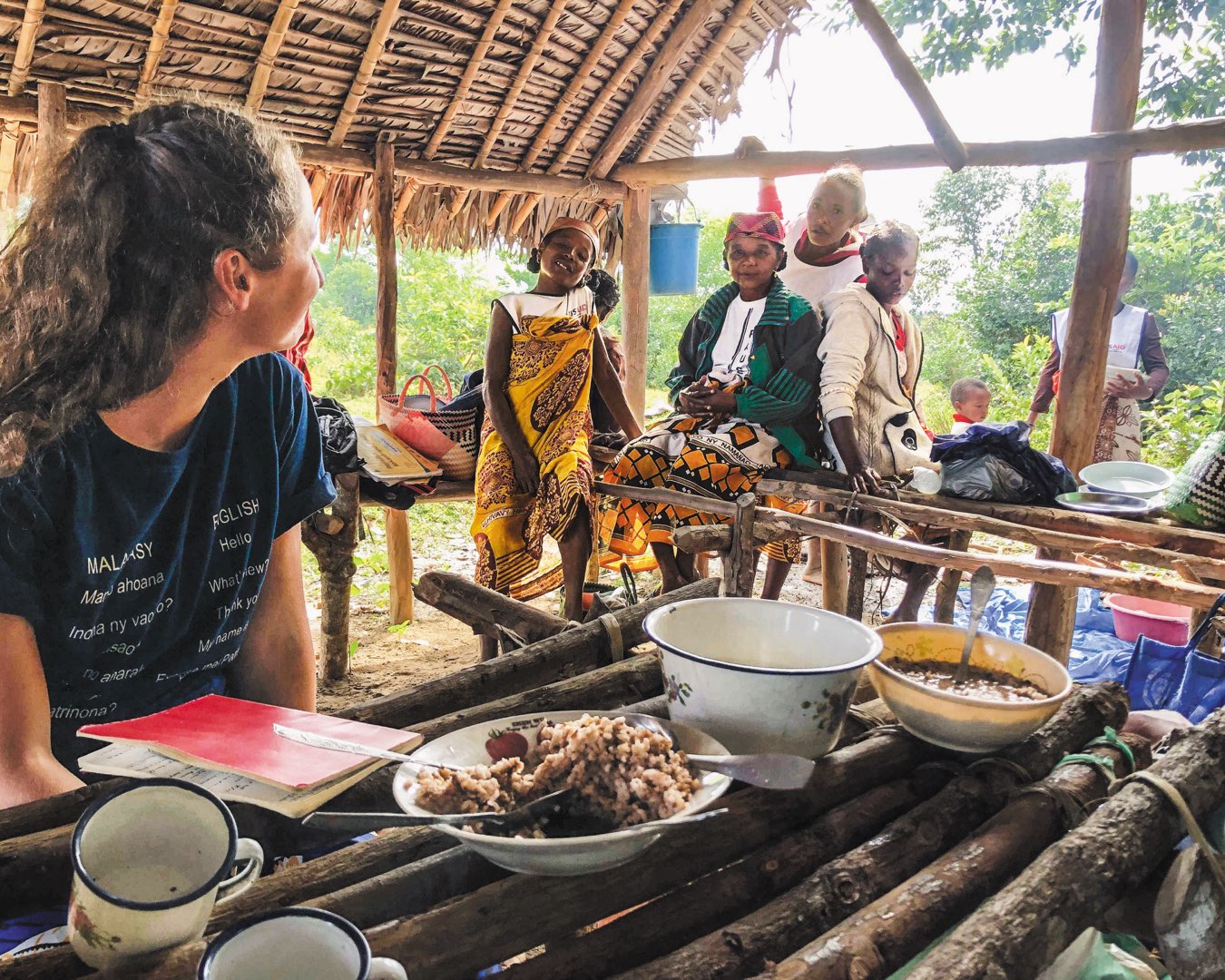 Edward Guinan and Giannina Guzman water plants.