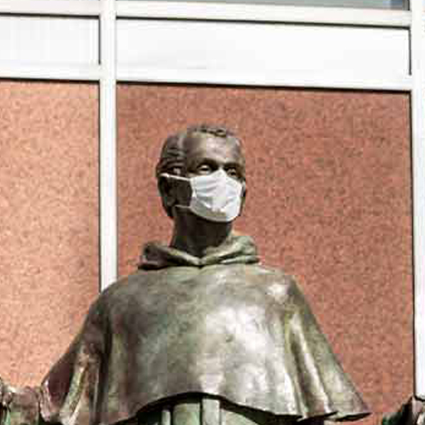 Villanova's statue of Gregor Mendel with mask on