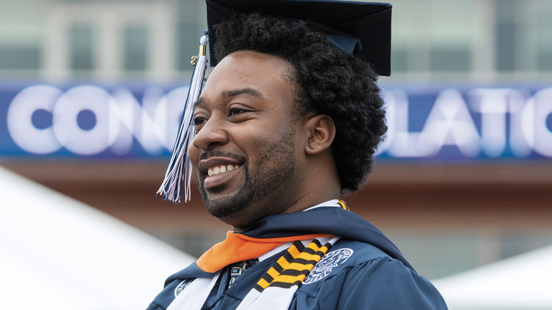 Villanova student wearing graduation robes.