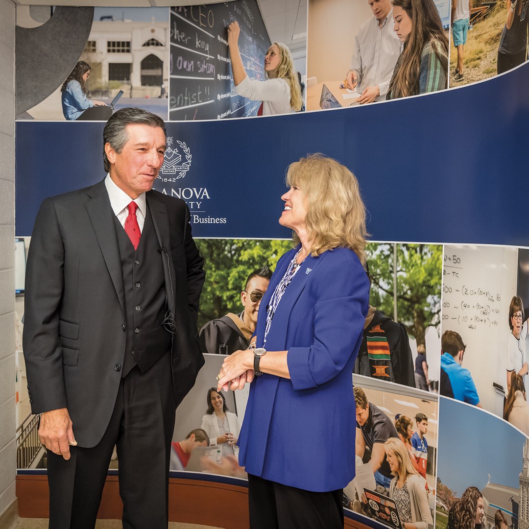 Villanova Alumnus Daniel M. DiLella standing with Joyce E. A. Russell, dean of the Villanova School of Business.
