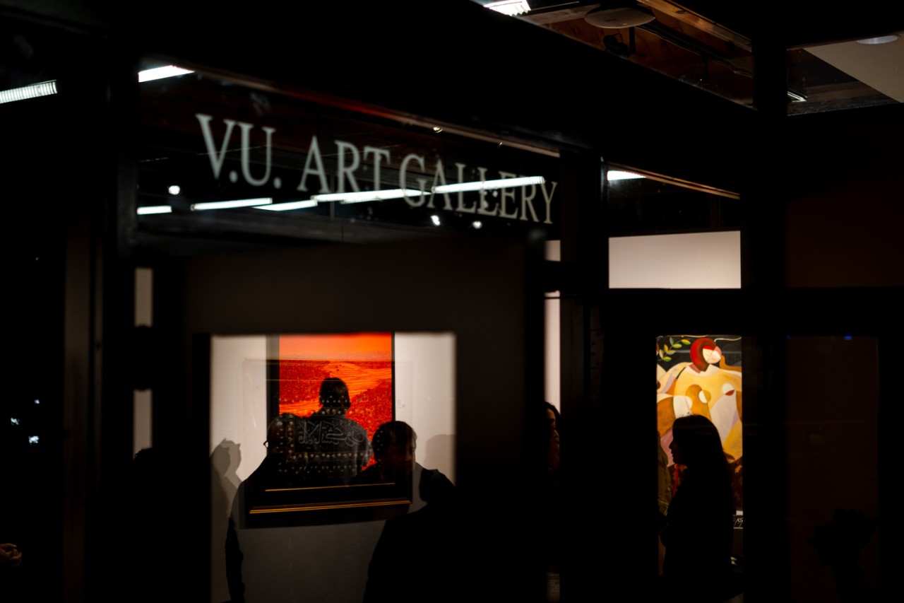 about-page Silhouettes walking throughout the art gallery