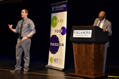 Villanova 3MT winner Samuel Sinemus presents on stage as Graduate Studies Dean Emory Woodard stands at the podium Villanova 3MT winner Samuel Sinemus presents on stage as Graduate Studies Dean Emory Woodard stands at the podium