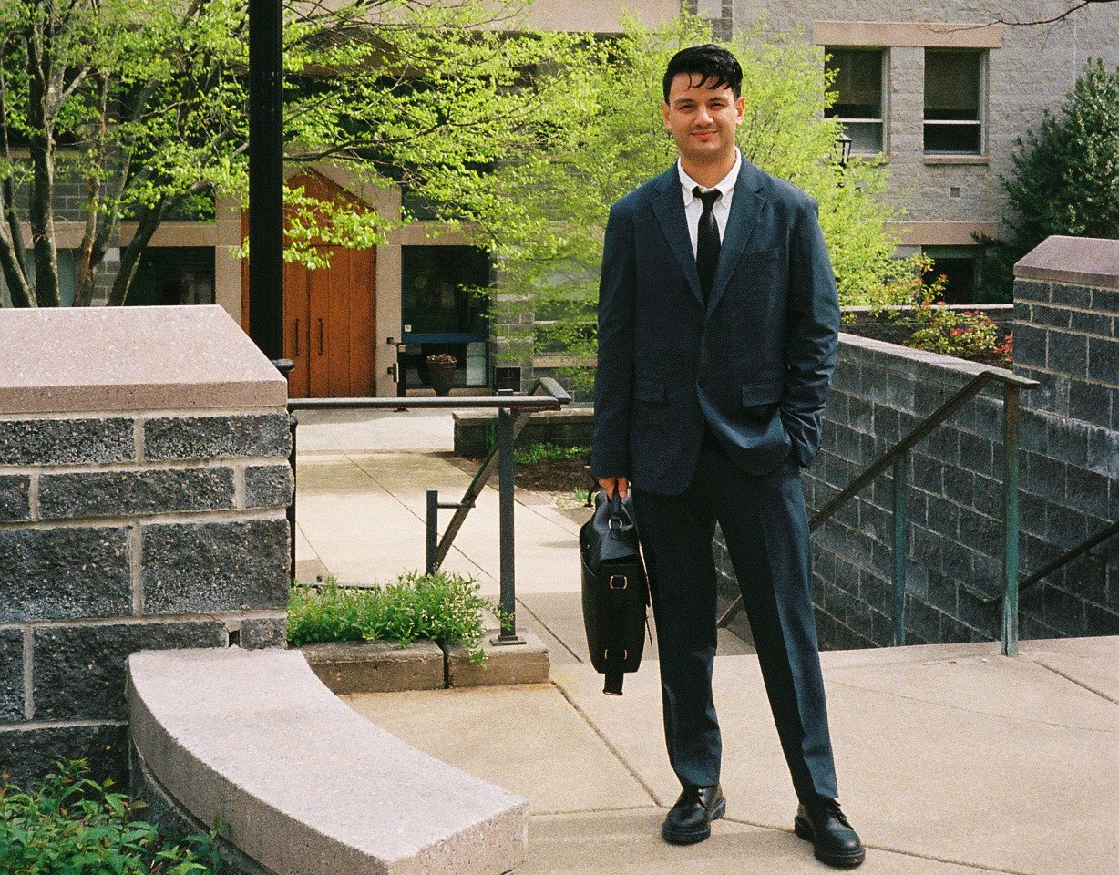 Christopher Quintana ’24 PhD in front of the St. Augustine Center Christopher Quintana ’24 PhD in front of the St. Augustine Center