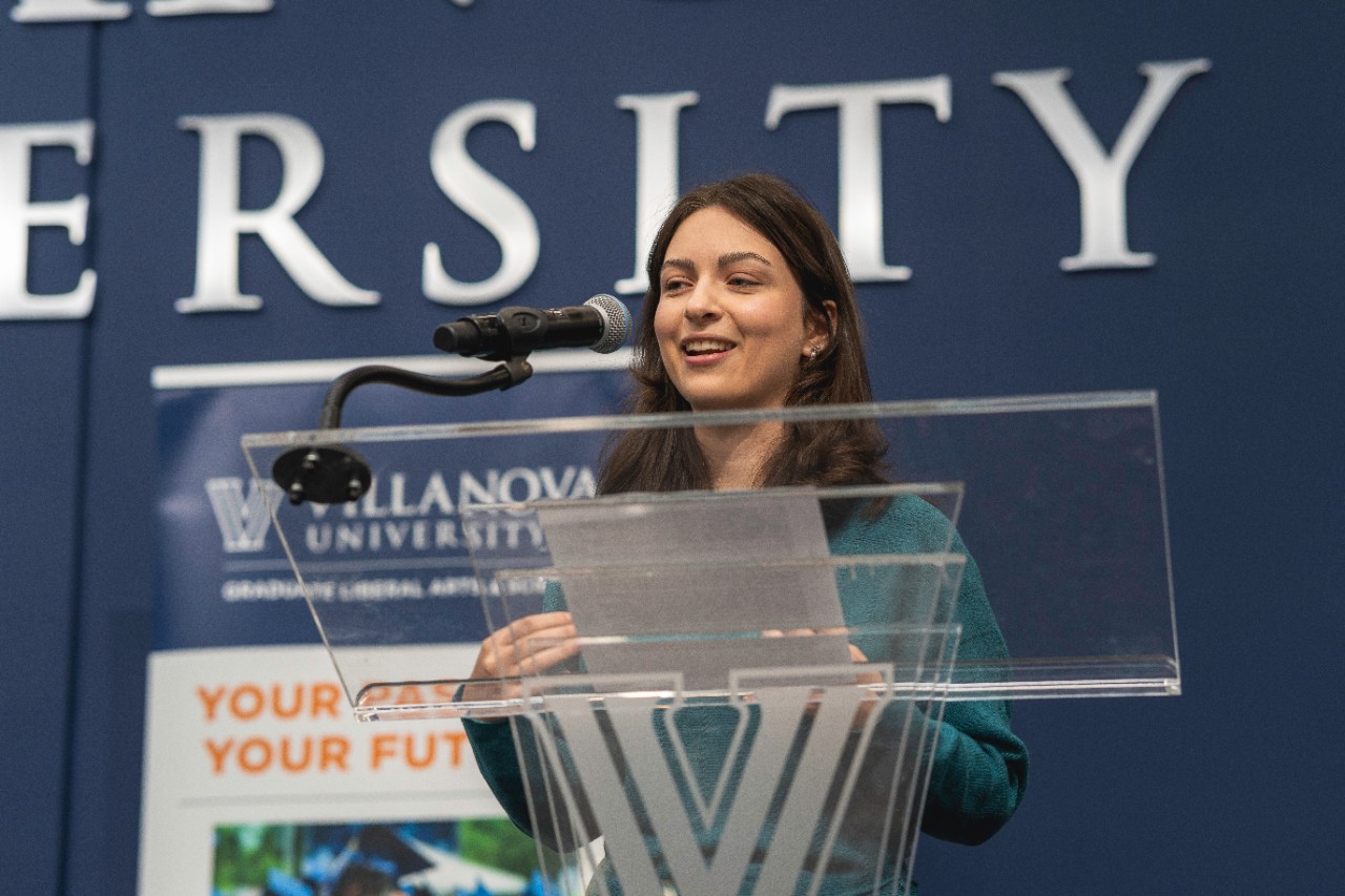 Graduate student presenting her work at the CLAS research symposium Graduate student presenting her work at the CLAS research symposium