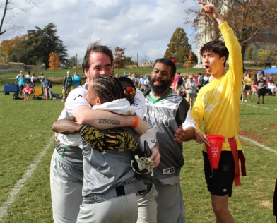 Athletes embrace during the flag fotball competition at the 2022 Fall Festival