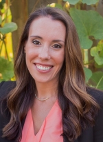 Katie D'Orazio Woman with blonde short hair smiling