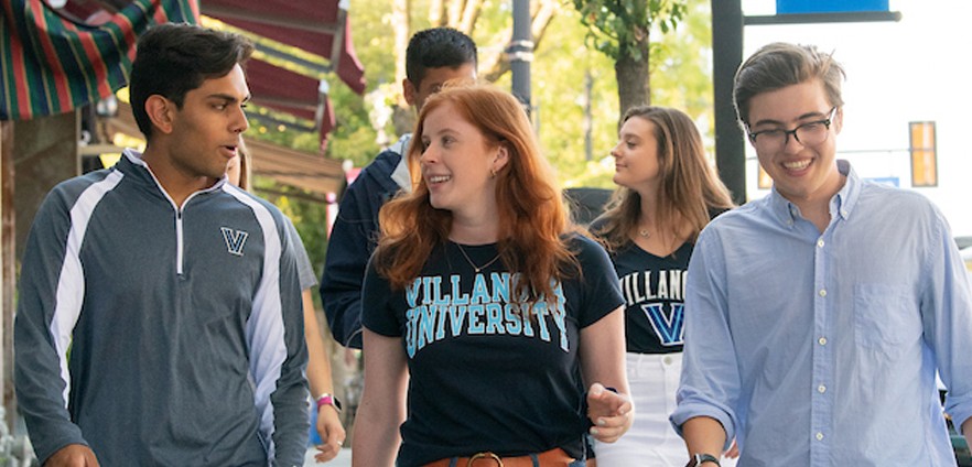 Group of students walking in town Group of students walking in town