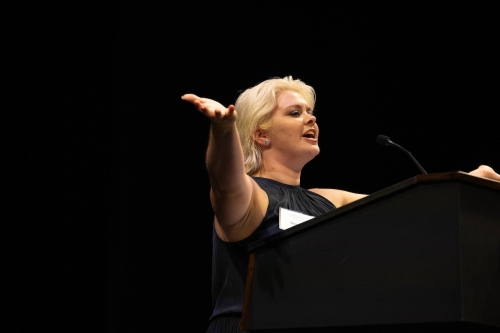 Giovanna Mitchell raises her arms