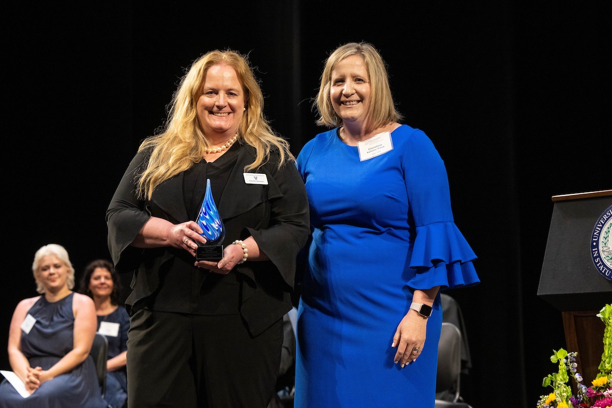 Meredith Okenquist receives her award