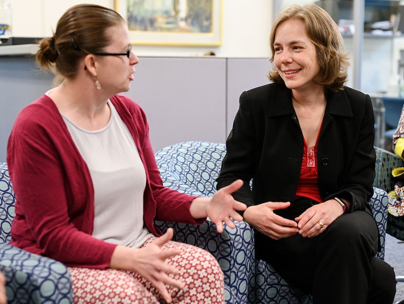 female-faculty-sitting-talking Female faculty speaking