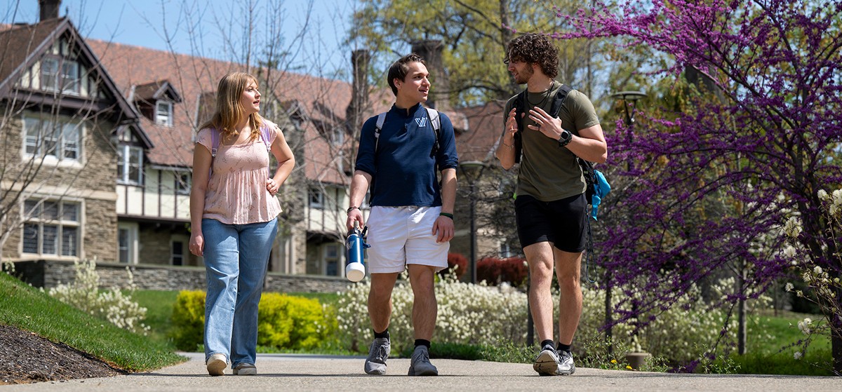 students walking on a Cabrini campus path students walking on a Cabrini campus path