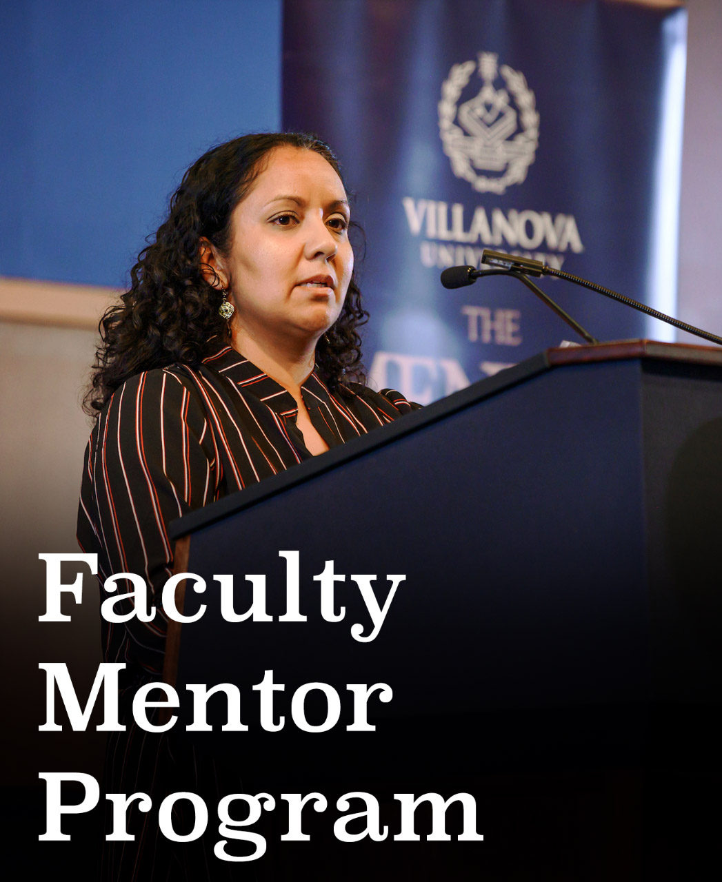 faculty is speaking behind the stand