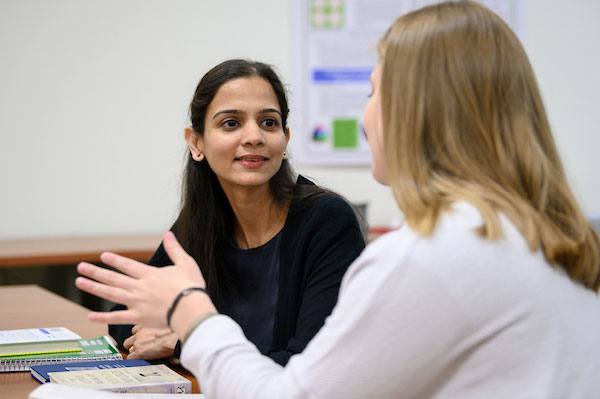 Tutor and student at table