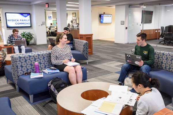 Students speaking to each other in the Nydick Commons