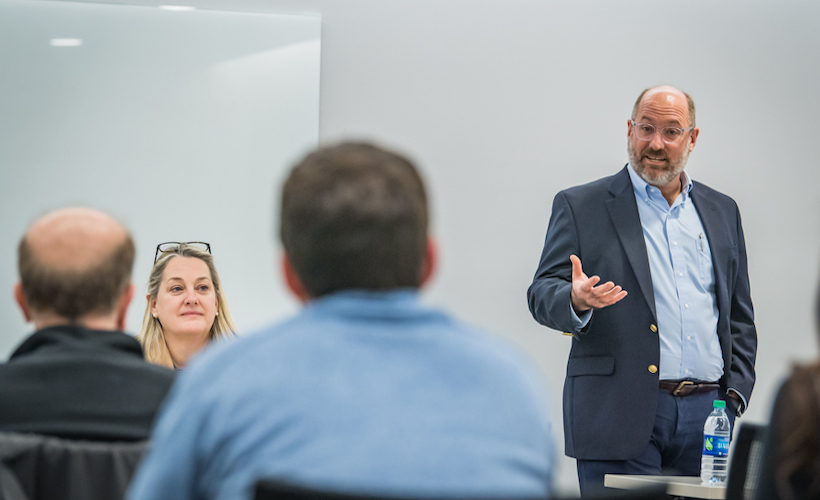 Assistant Dean Matthew Carluzzo instructs a class.