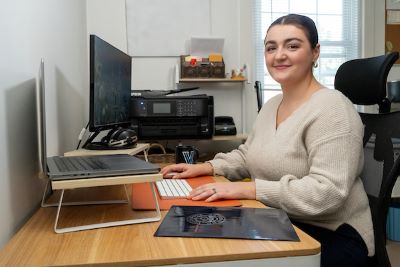 woman in an office looking at the camera