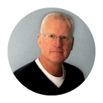 man in glasses looking at the camera