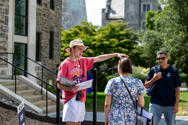 An Orientation Counselor helps with directions around campus