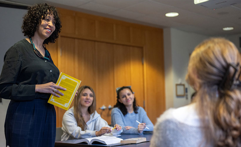 Female professor standing in front of students